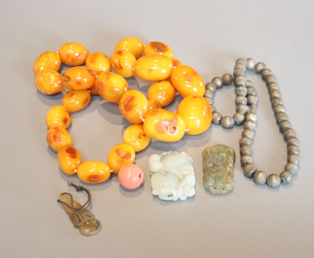 A group of Chinese jewellery to include an amber necklace and a bead necklace